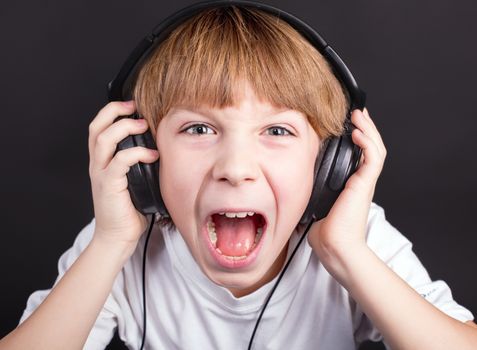 Young boy's singing with headphones