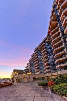 Building and promenade in Geneva by sunset, Switzerland, HDR