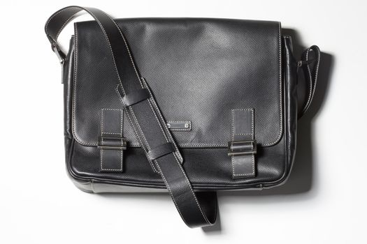 Hipster black leather handbag on white. Tredy accessory