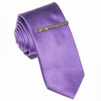 purple tie on a white background. Close up