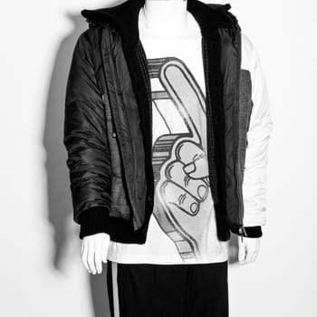 mannequin dressed in hipster male clothes on white background. white and black colour