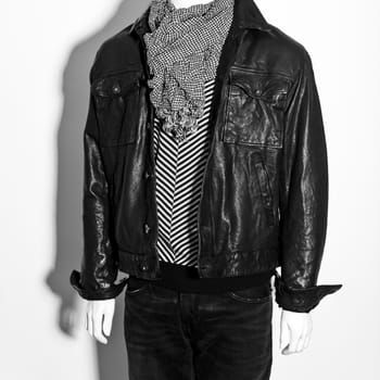 mannequin dressed in hipster male clothes on white background. white and black colour