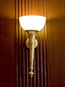 Lighted classic sconce on the wall