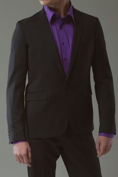 man in elegant suit on a dark background