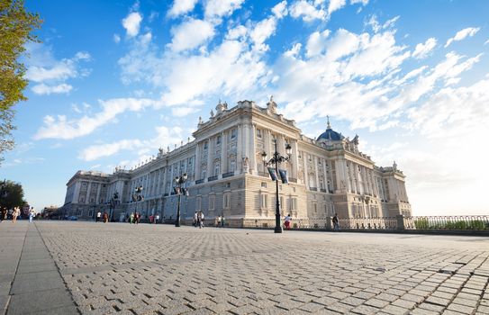 Madrid, Spain - May 6, 2012: Royal palace (Palacio Real de Madrid) with tourists on a spring day in Madrid, Spain