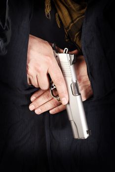 man holding a pistol close up