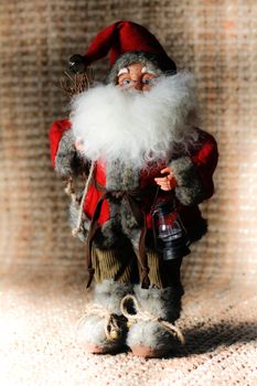 Mini Santa Claus on a background of rattan mats