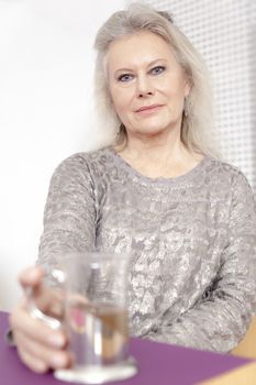 An image of a best age woman with a cup of tea