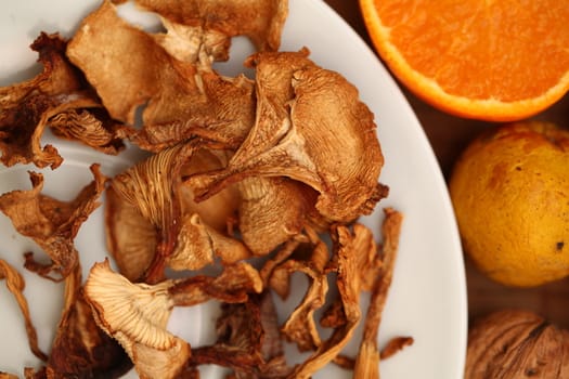 Dried mushroom chanterelle onthe white plate