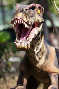 Prehistoric era dinosaur walking forest showing his toothy mouth
