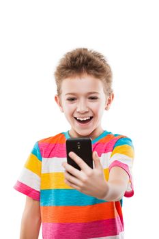 Little smiling child boy hand holding mobile phone or smartphone making selfie portrait photo white isolated