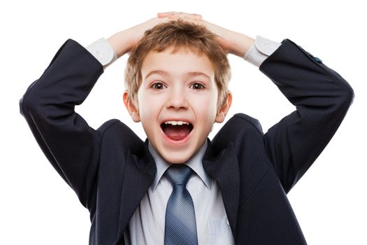 Amazed or surprised child boy in business suit hand holding hairs on head white isolated