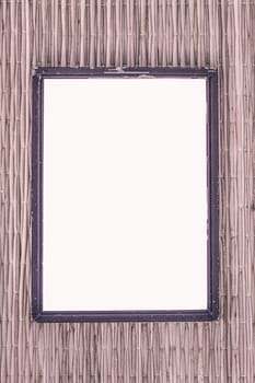 wooden old black picture frame on traditional mat with white space in the middle, vintage filter