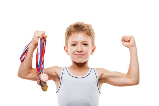 Sport success and win concept - smiling athlete champion child boy hand holding first place victory gold medal award