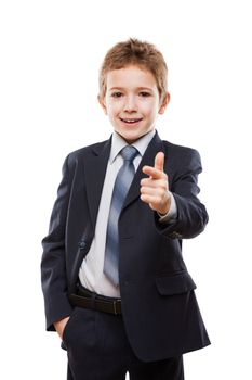 Handsome smiling child boy in business suit index finger pointing direction way or campaign agitating choice white isolated