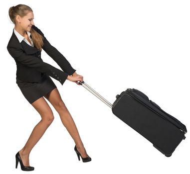 Businesswoman dragging heavy wheeled suitcase at utmost strain. Isolated over white background