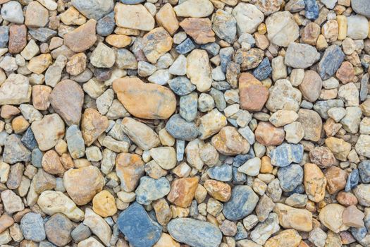 colorful pebble stones texture on the beach