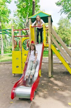 Photo of two active girls on nursery platform