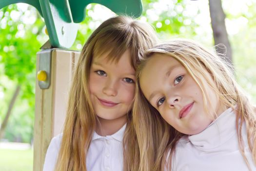 Photo of two cute girls with long hairs