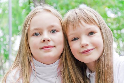 Photo of two cute girls with long hairs