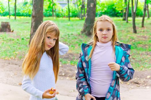 Photo of two cute girls with long hairs