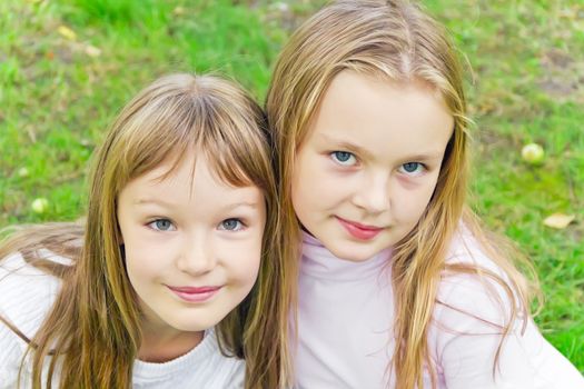 Photo of two cute girls with long hairs