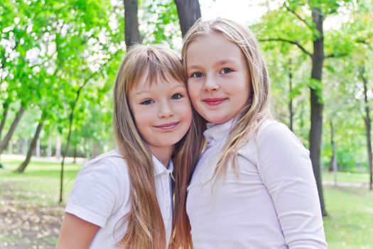 Photo of two cute girls with long hairs