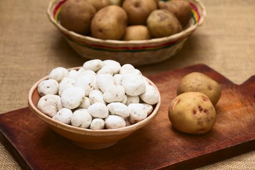 Tunta, also called white chuno or moraya, is a freeze-dried (dehydrated) potato made in the Andes region, mainly Bolivia and Peru. The potato is durable for a long time this way. Tunta and chuno are used in many traditional dishes in Bolivia (Selective Focus, Focus one third into the potatoes in the bowl) (Photographed with natural light)