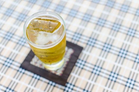 glass of beer on blurred background