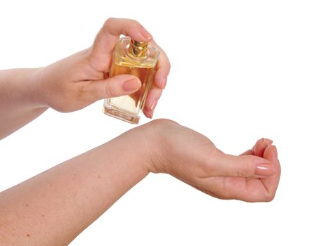 Woman applying perfume on her wrist