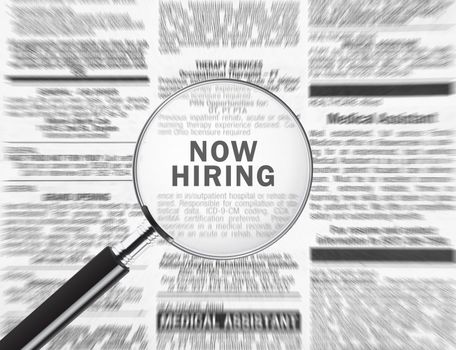 Now hiring ad through a magnifying glass