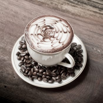 Cup of coffee on a wooden table