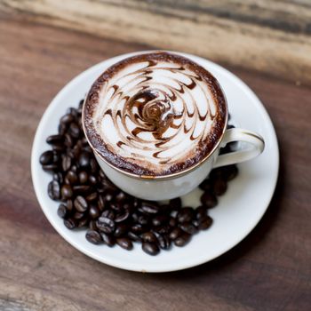 Cup of coffee on a wooden table