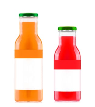Orange and strawberry juices in glass bottles