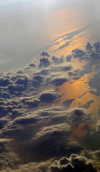 Earth view from above with clouds and sea reflections