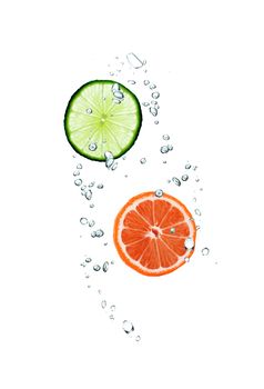 slice of grapefruit and lime in water