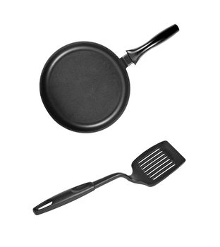 Pan with black plastic kitchen spatula isolated on white