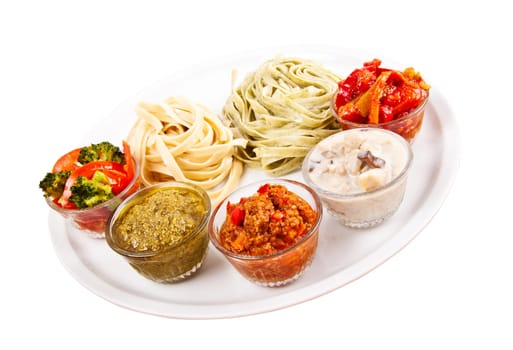 two choices of pasta and various spices on plate