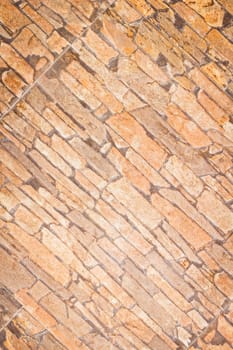 Outside natural limestone brickwall texture close up view.
