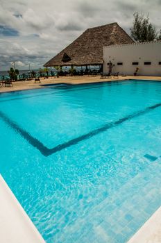 Large clean and inviting swimmingpool at a resort.