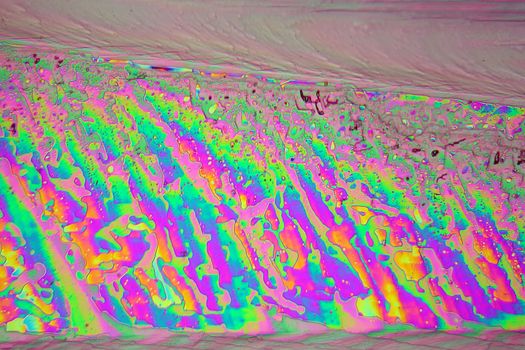 Lanthanum nitrate crystals under a microscope with a magnification of 100x and in polarized light.