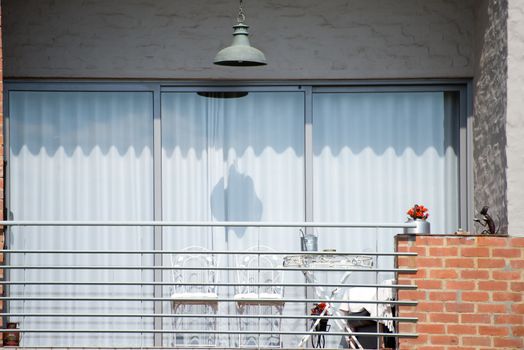 Balcony of a newly build house in a retro style.