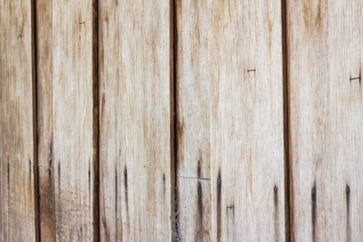 Close up of gray wooden fence panels, perspective.