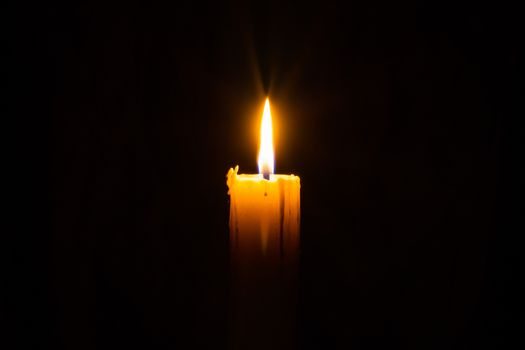Candle in the darkness with copyspce