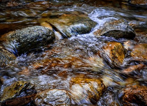 abstract autumn background or texture pebbles in a stream