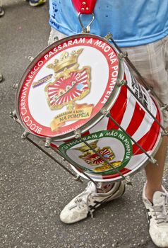 SAO PAULO, BRAZIL - JANUARY 31, 2015: An unidentified man struck the drum during the annual Brazilian street carnival.