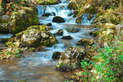 beautiful blue waterfall between rocks in Serbian mountain