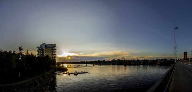 Sunset over River in City