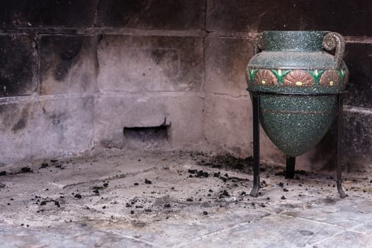 old amphora in a fireplace off