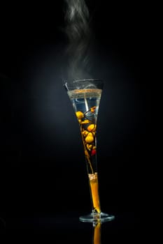 steaming glass on a black background